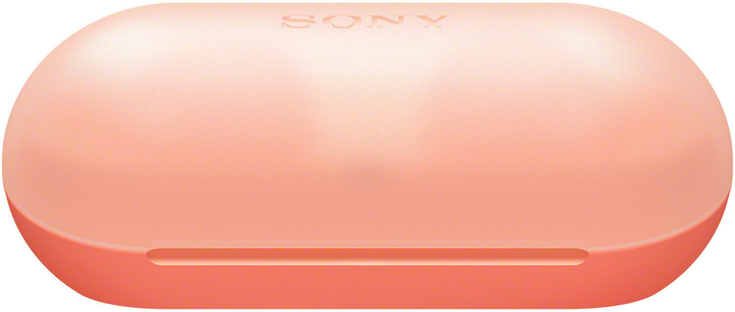 Brzoskwiniowe etui ładujące do słuchawek, z logo Sony na górze.
