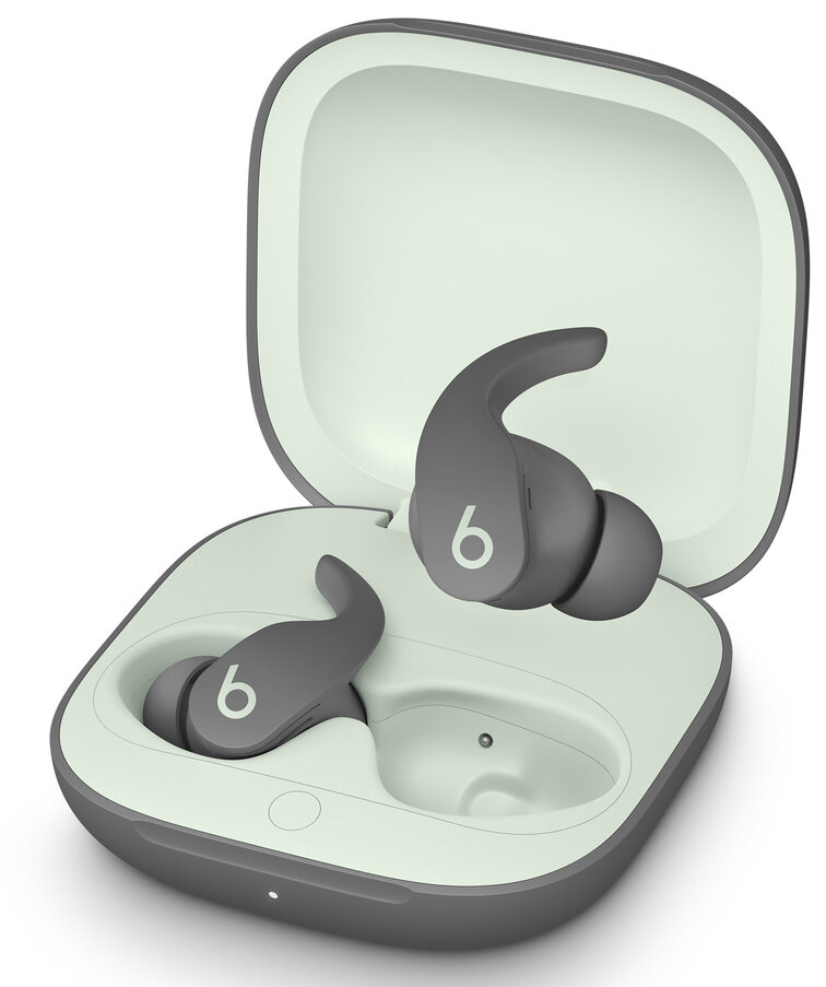 Szare słuchawki Beats w otwartym etui. Etui jest szare, z miętowym wnętrzem.