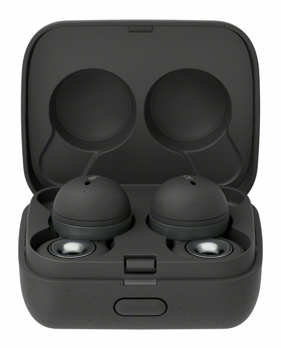 Ciemnoszare słuchawki douszne w otwartym etui ładującym. Etui jest teksturowane.