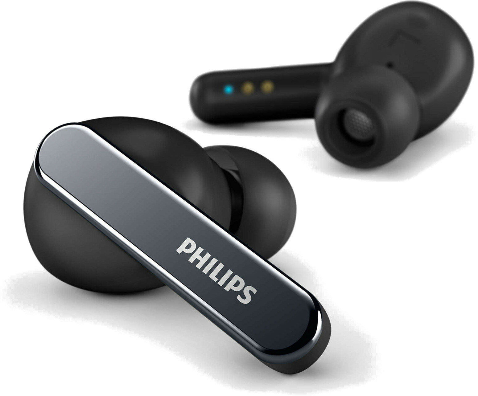 Czarne i srebrne słuchawki douszne. Nazwa marki PHILIPS widoczna na słuchawkach.