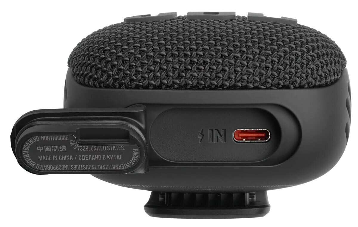 Czarny, okrągły głośnik z siatkowym wierzchem i portem USB-C.