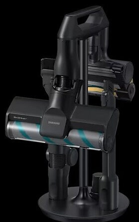 Czarny odkurzacz na stojaku, akcesoria z boku. Czarne tło.