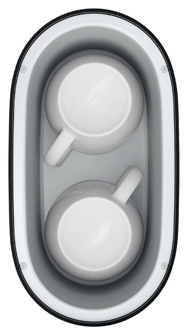 Widok z góry na dwa białe filiżanki do kawy w czarno-szarej podgrzewaczu do ekspresu Jura.