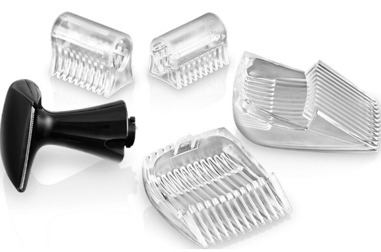 Zestaw nasadek do maszynki do włosów. Zawiera czarny uchwyt i wiele przezroczystych, plastikowych osłon.