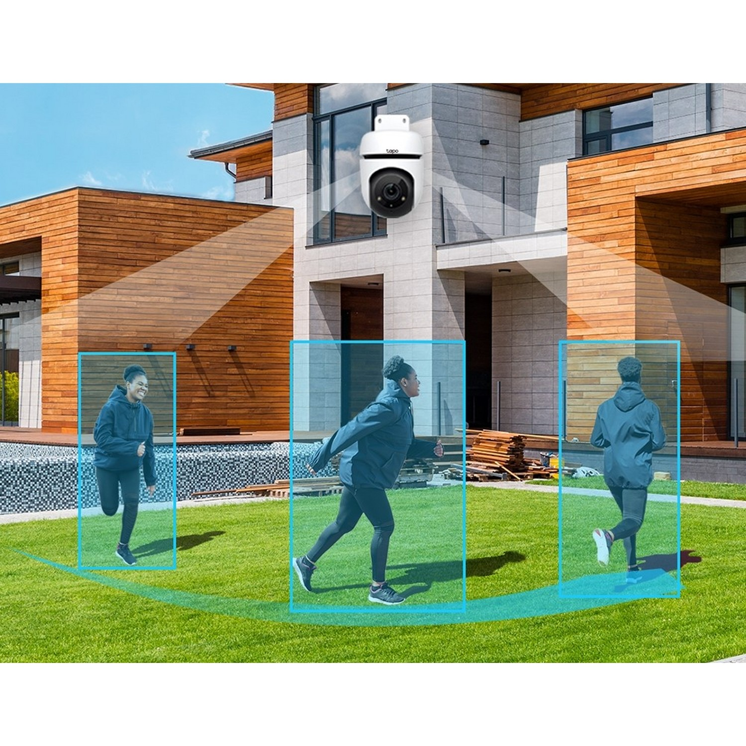 Exterior security camera with three people running. It is mounted on a house.