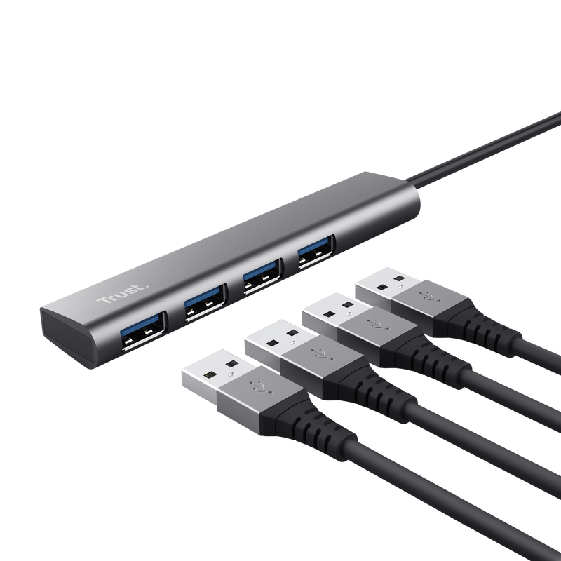 Hub USB Trust plateado con cuatro puertos USB y cuatro cables USB negros.