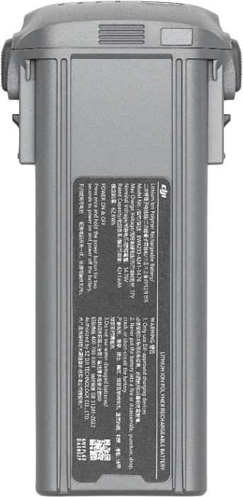 Graue Drohnenbatterie mit Textdetails auf dem Etikett, zeigt Warnungen.