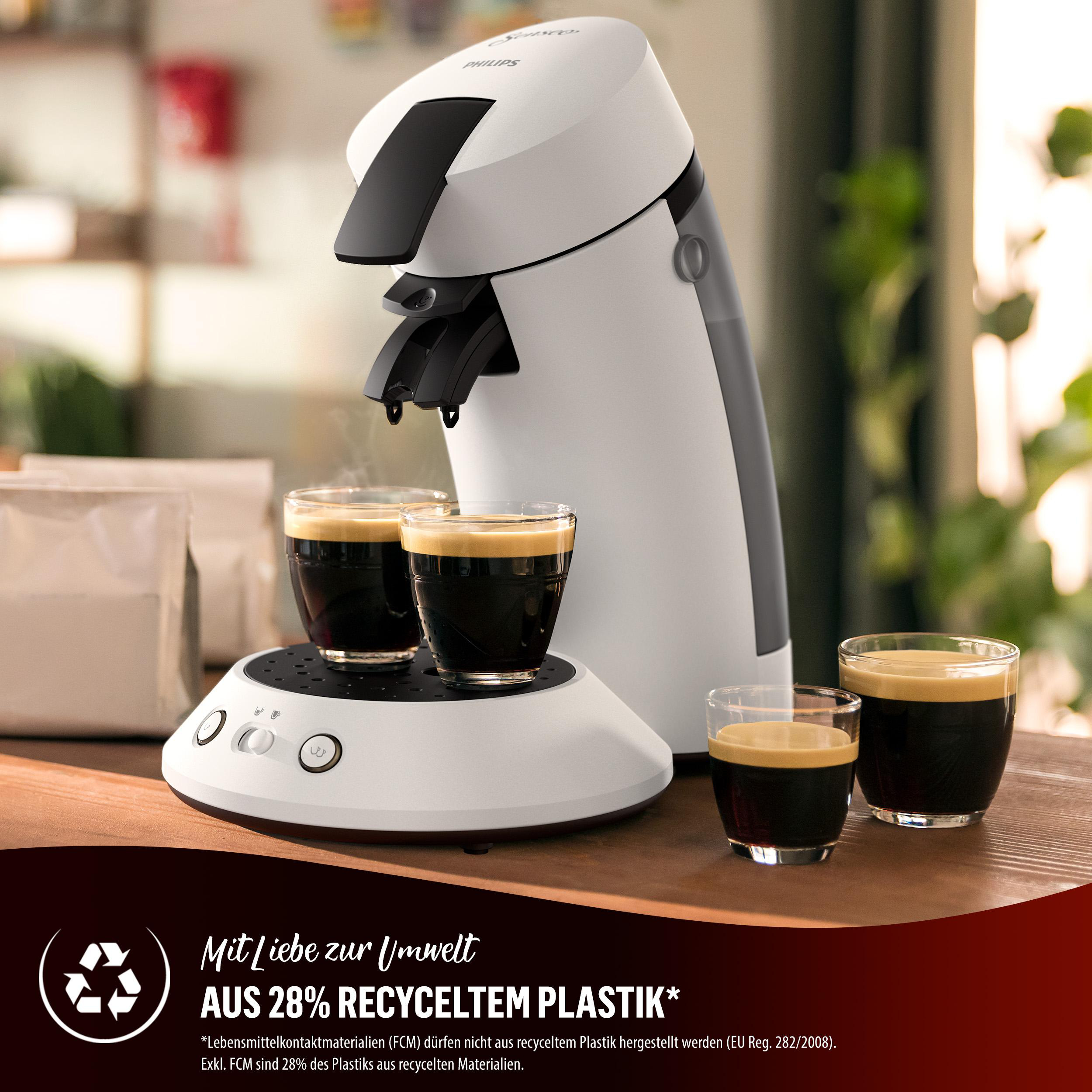 Eine weiße und schwarze Philips Senseo Kaffeemaschine mit zwei Kaffeetassen und zwei weiteren.