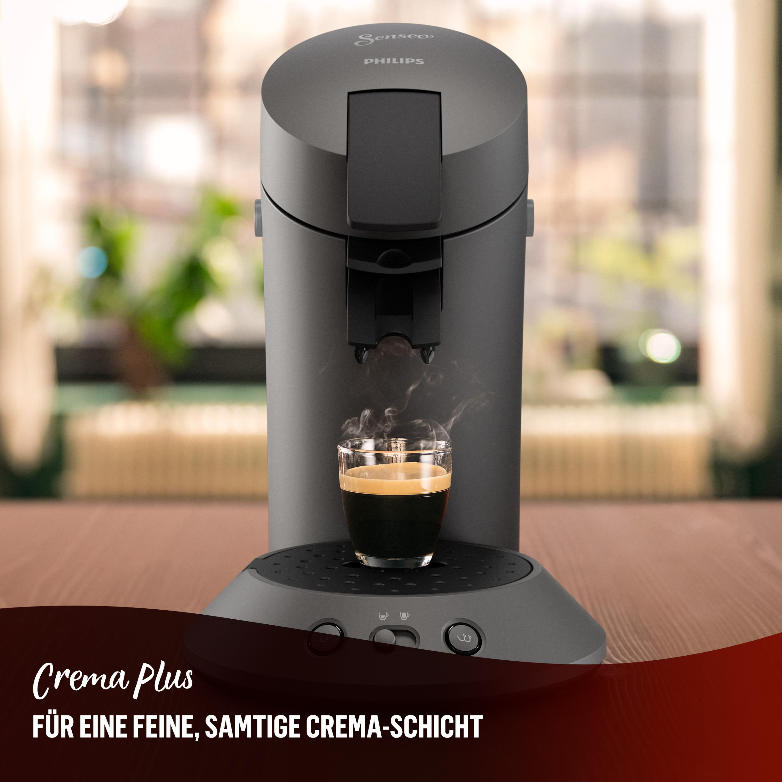 Eine graue Philips Senseo Kaffeemaschine mit einer Tasse Kaffee und Text-Overlay.