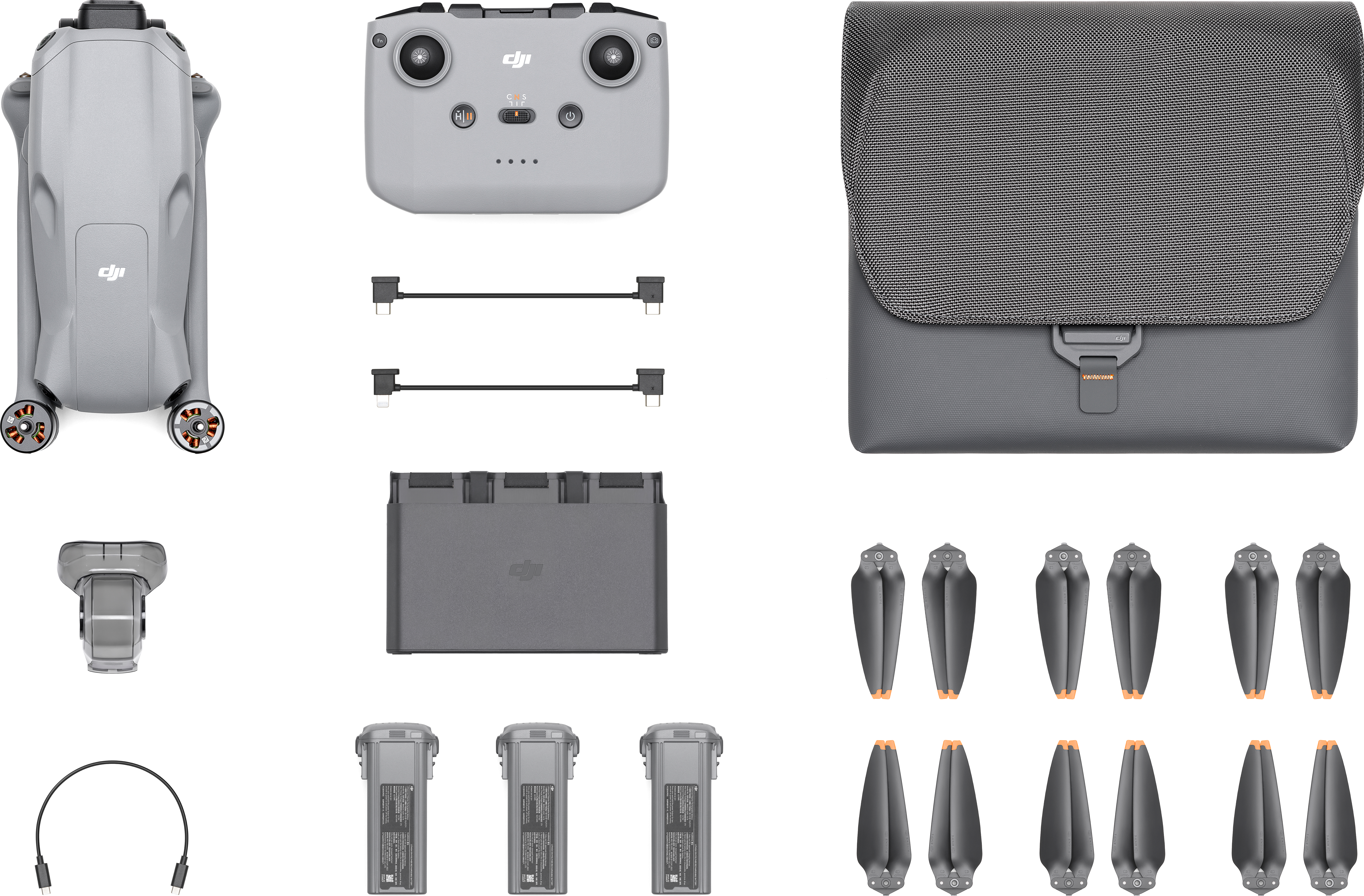 Kit drone DJI con drone, controller, eliche, batterie, hub di ricarica, cavi e custodia. Colore grigio.