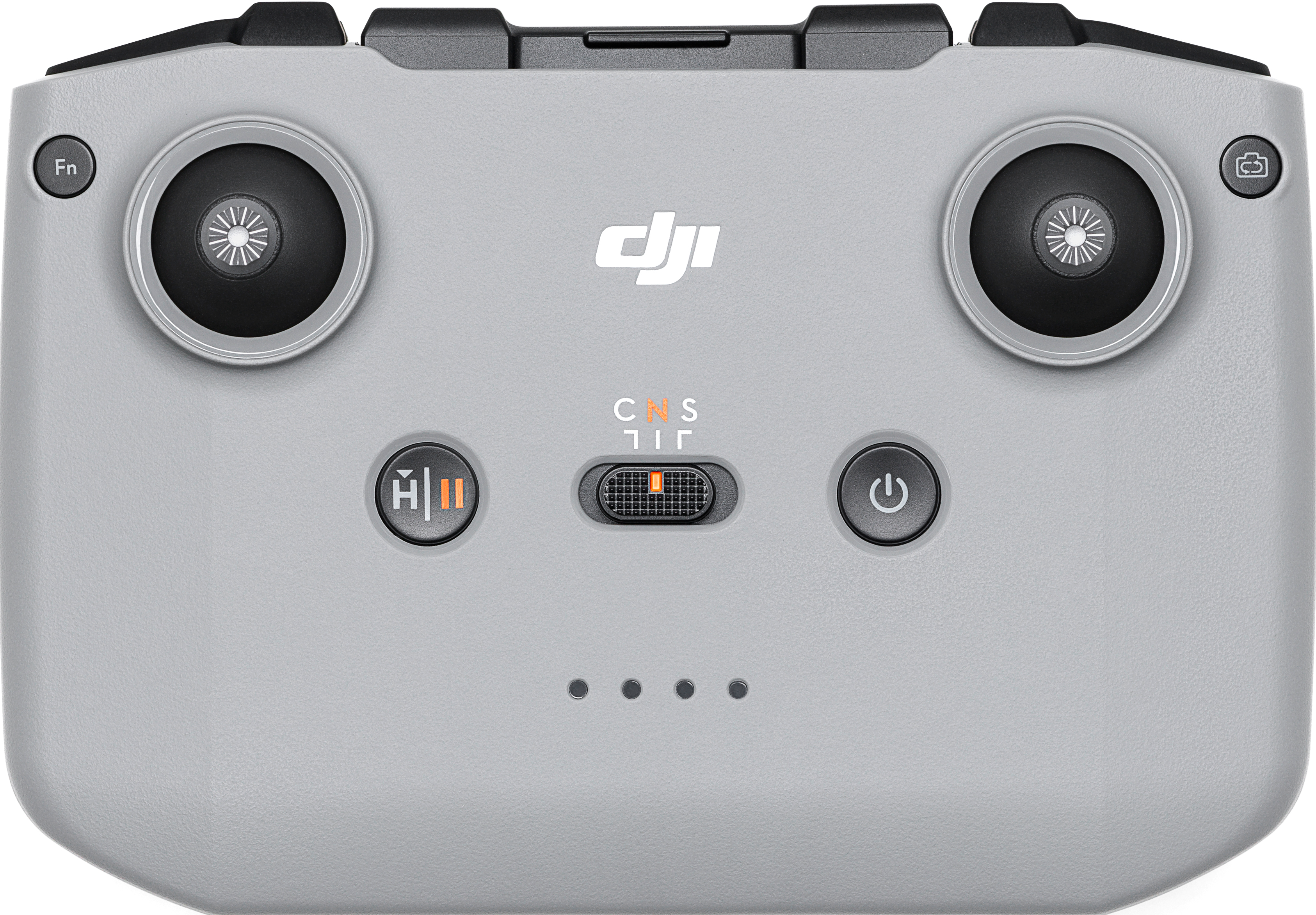 Un controller drone grigio con joystick, pulsanti e interruttore di modalità centrale.