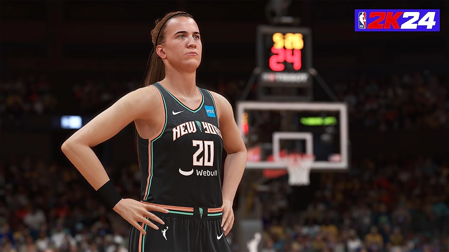 Une joueuse de basket-ball en maillot noir, debout sur le terrain, regardant en l'air.