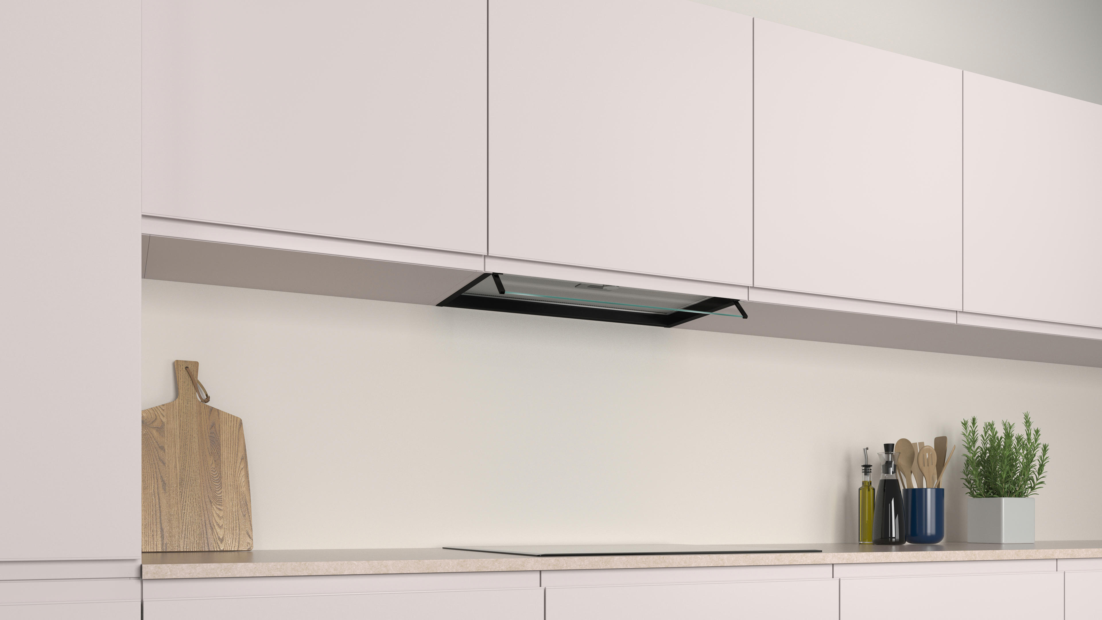 Cocina moderna con campana extractora y armarios de color claro.