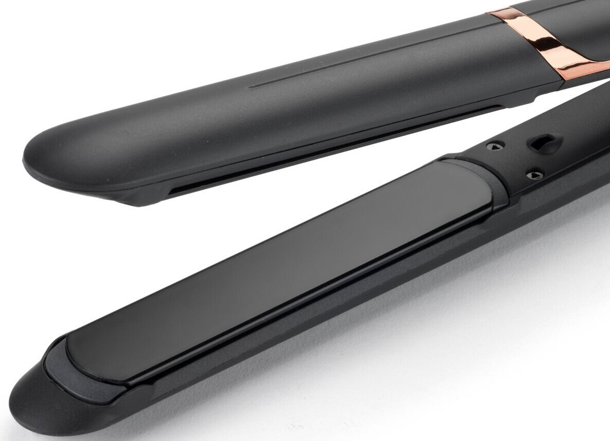 Czarna prostownica do włosów, otwarta, z czarnymi i różowo-złotymi płytkami.