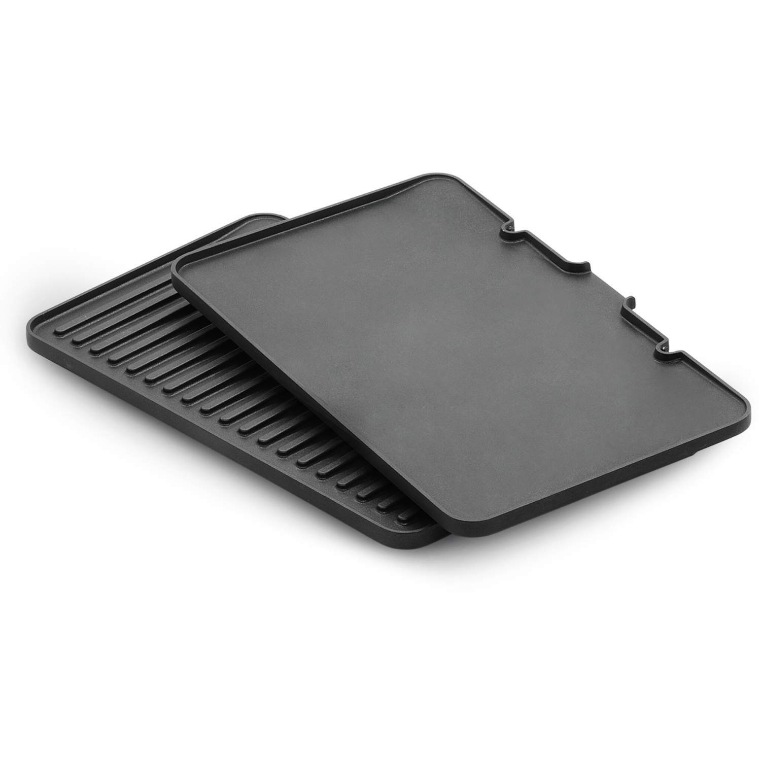 Two black grill plates stacked, one with ridges, white background.