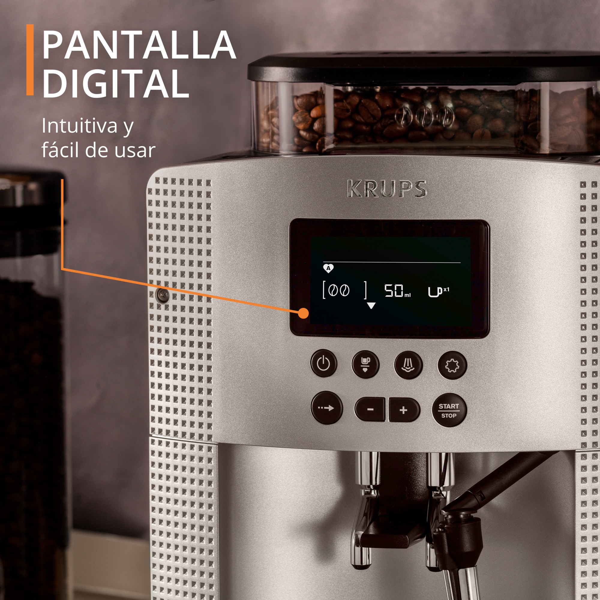 Una cafetera Krups plateada con pantalla digital y granos de café en un recipiente.