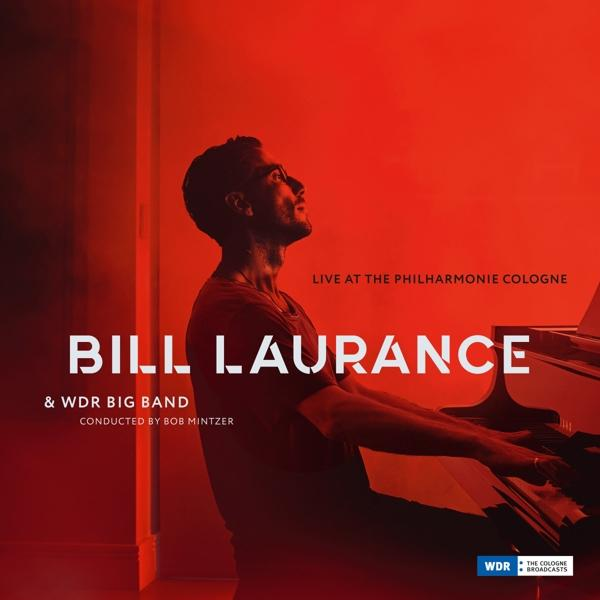 Bill Laurance zongorázik az album borítóján. Piros háttér. Szöveg: Live at the Philharmonie Cologne & WDR Big Band.