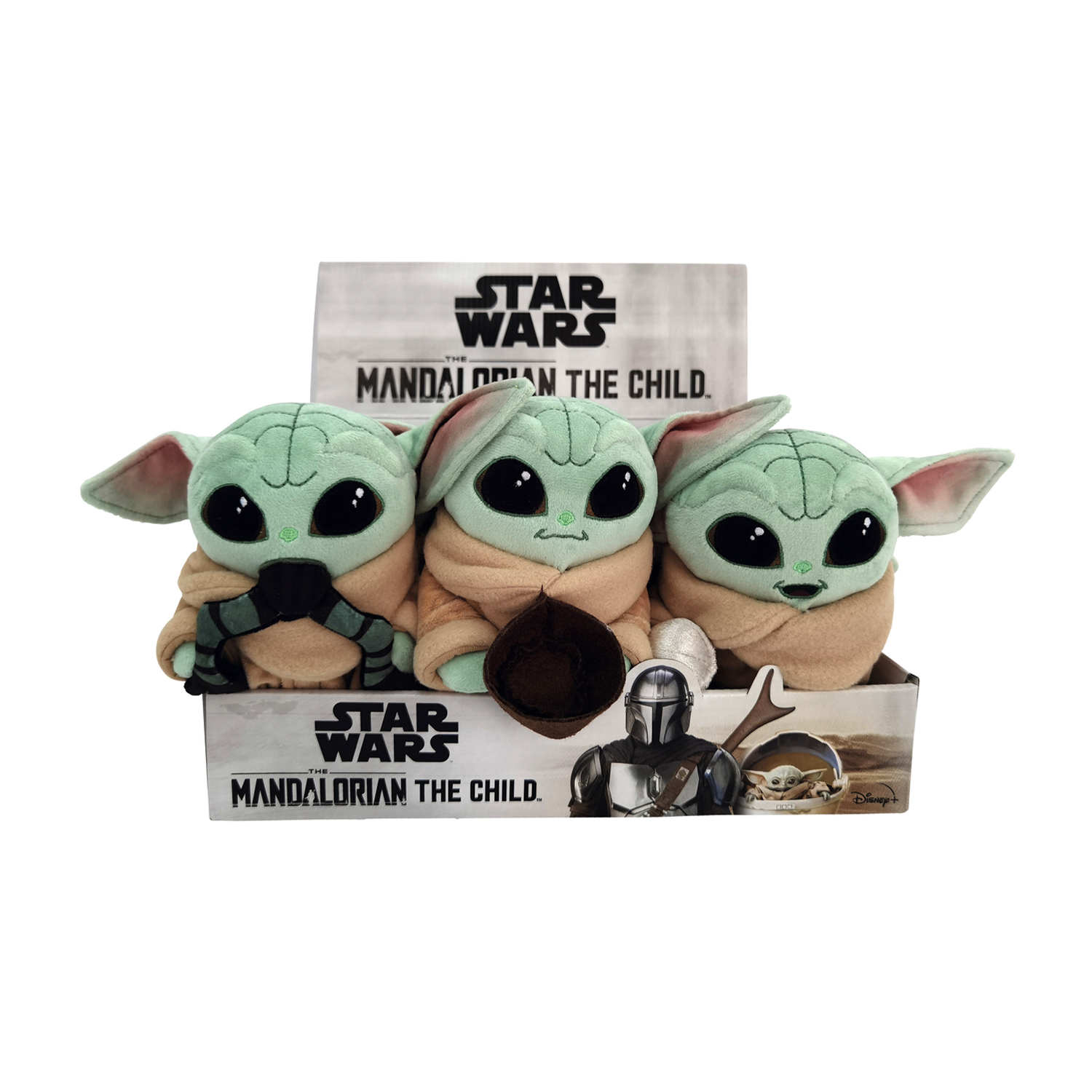 Tre peluche di Baby Yoda in una scatola. Star Wars Mandalorian The Child è scritto sulla scatola.