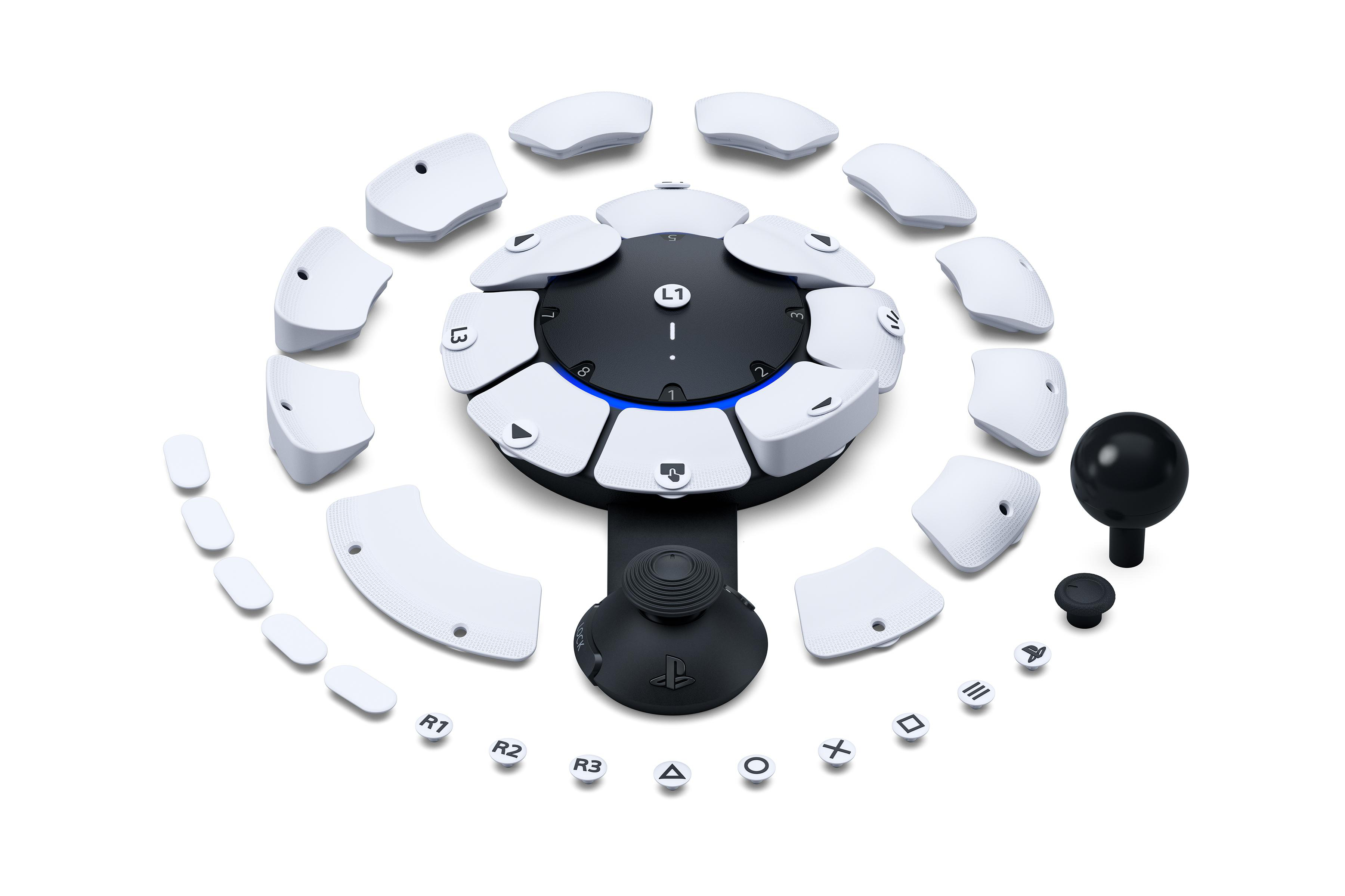 Weißer Controller mit abnehmbaren Tasten und Joystick.