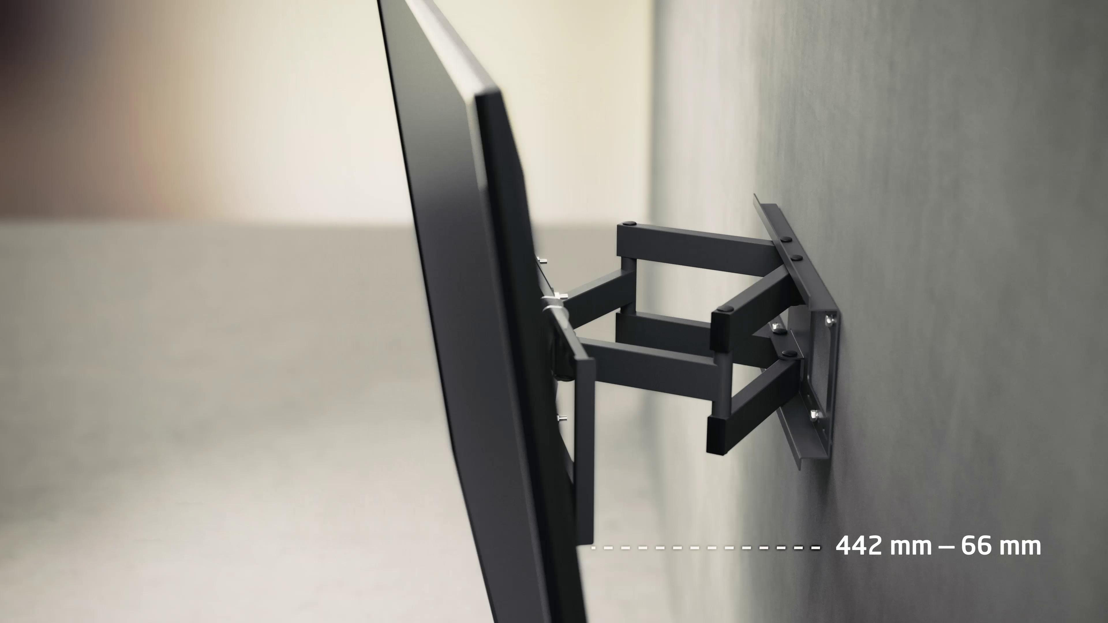 TV-Bildschirm an einer Wand montiert. Schwarze Halterung und TV, Seitenansicht.