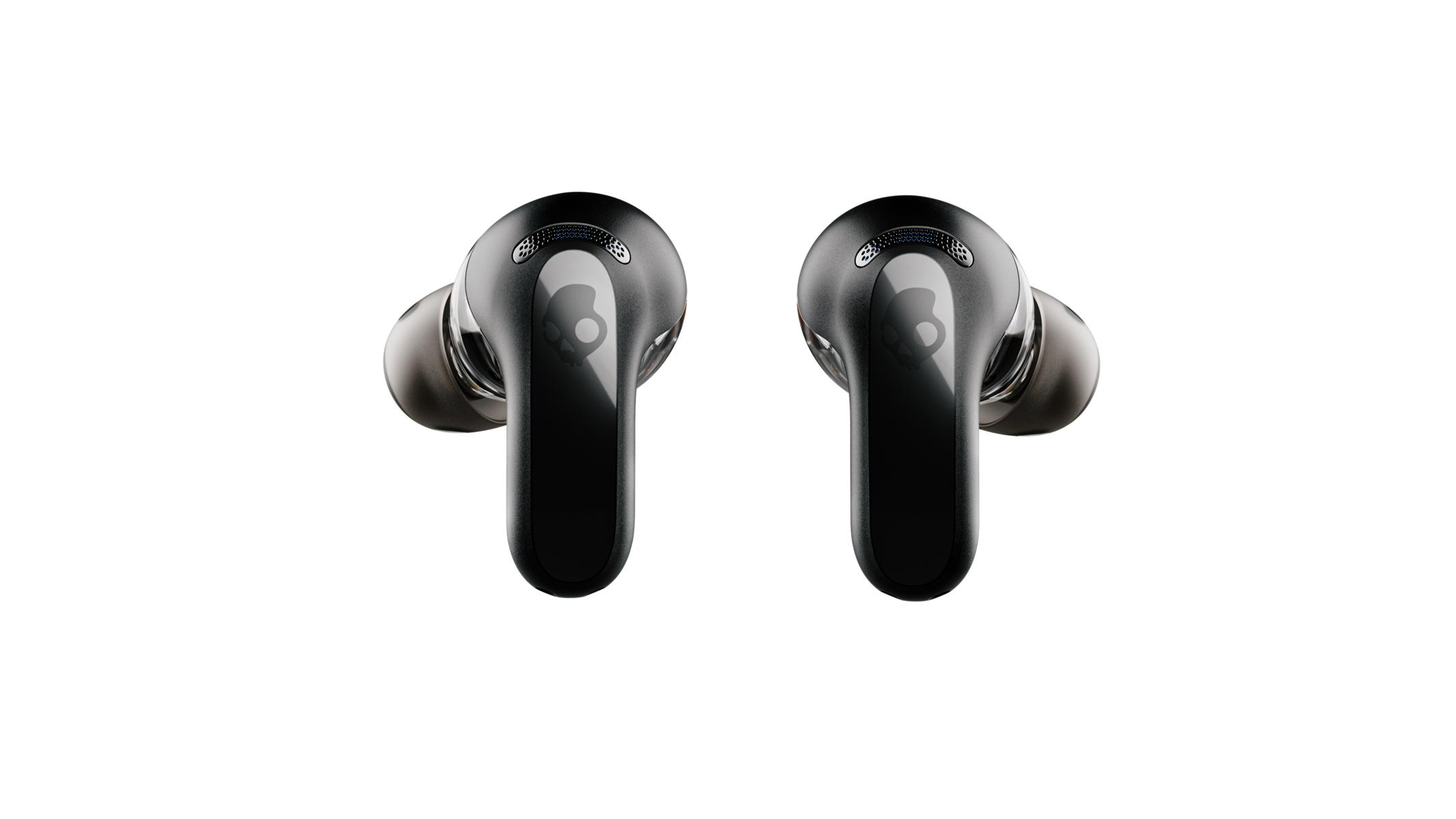 Két fekete Skullcandy fülhallgató koponya logóval, sötét háttér előtt.