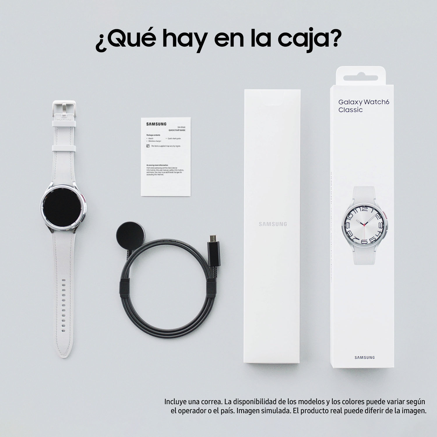Un reloj blanco, cargador, cable y caja sobre una superficie gris claro.