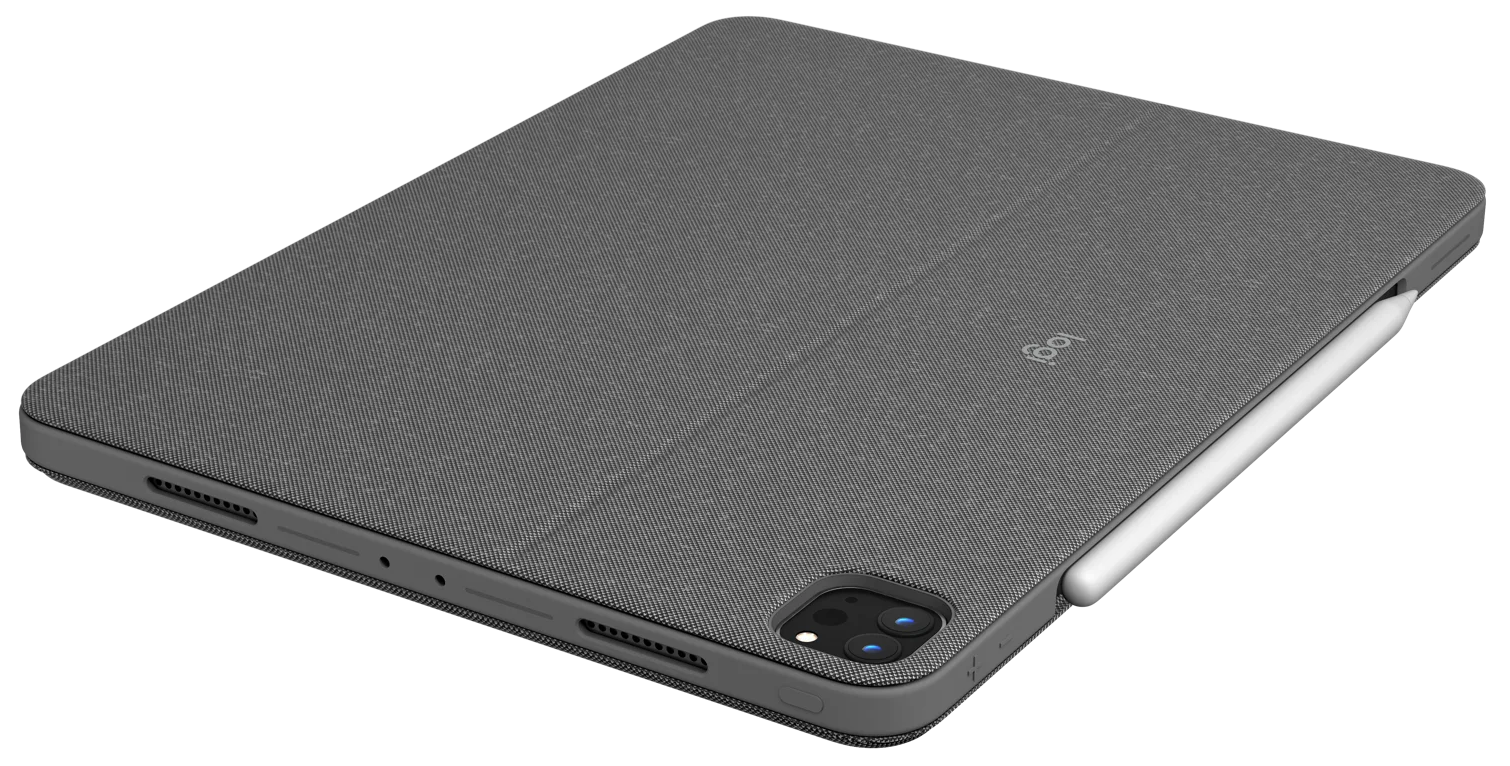 Szürke tablet ceruzával, sötét felületen, szögből.