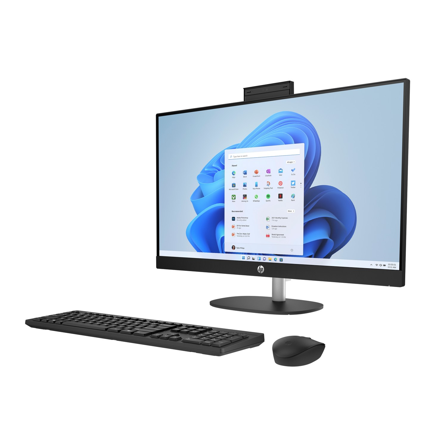 All-in-one computer with keyboard, mouse, and webcam. The screen shows a Windows desktop with icons.