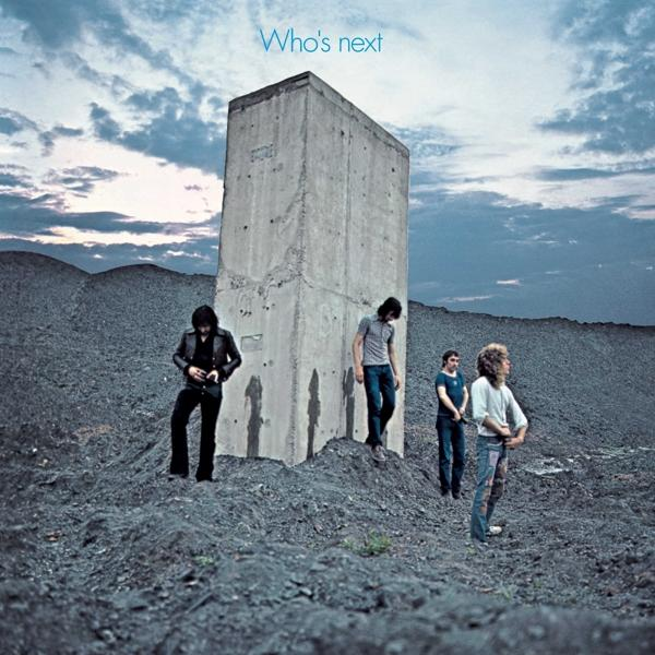 Albumcover von 'Who's Next' von The Who. Band steht in der Nähe von Beton.