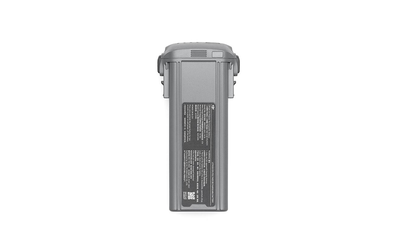 Graue Drohnenbatterie. Schwarzes Etikett mit Text und QR-Code an der Seite.