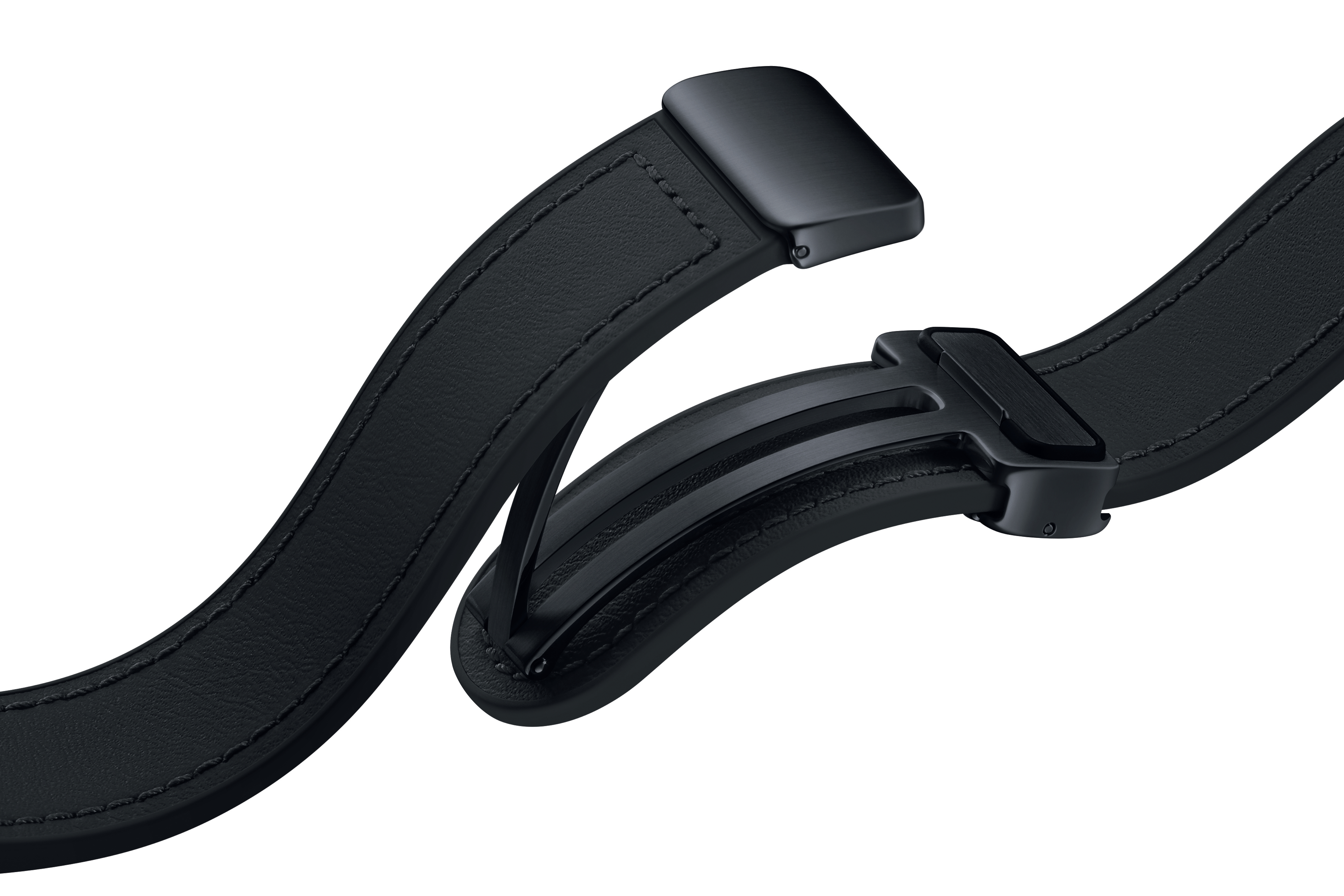 Ein schwarzer Uhrenarmbandverschluss, der den inneren Mechanismus zeigt. Weißer Hintergrund.