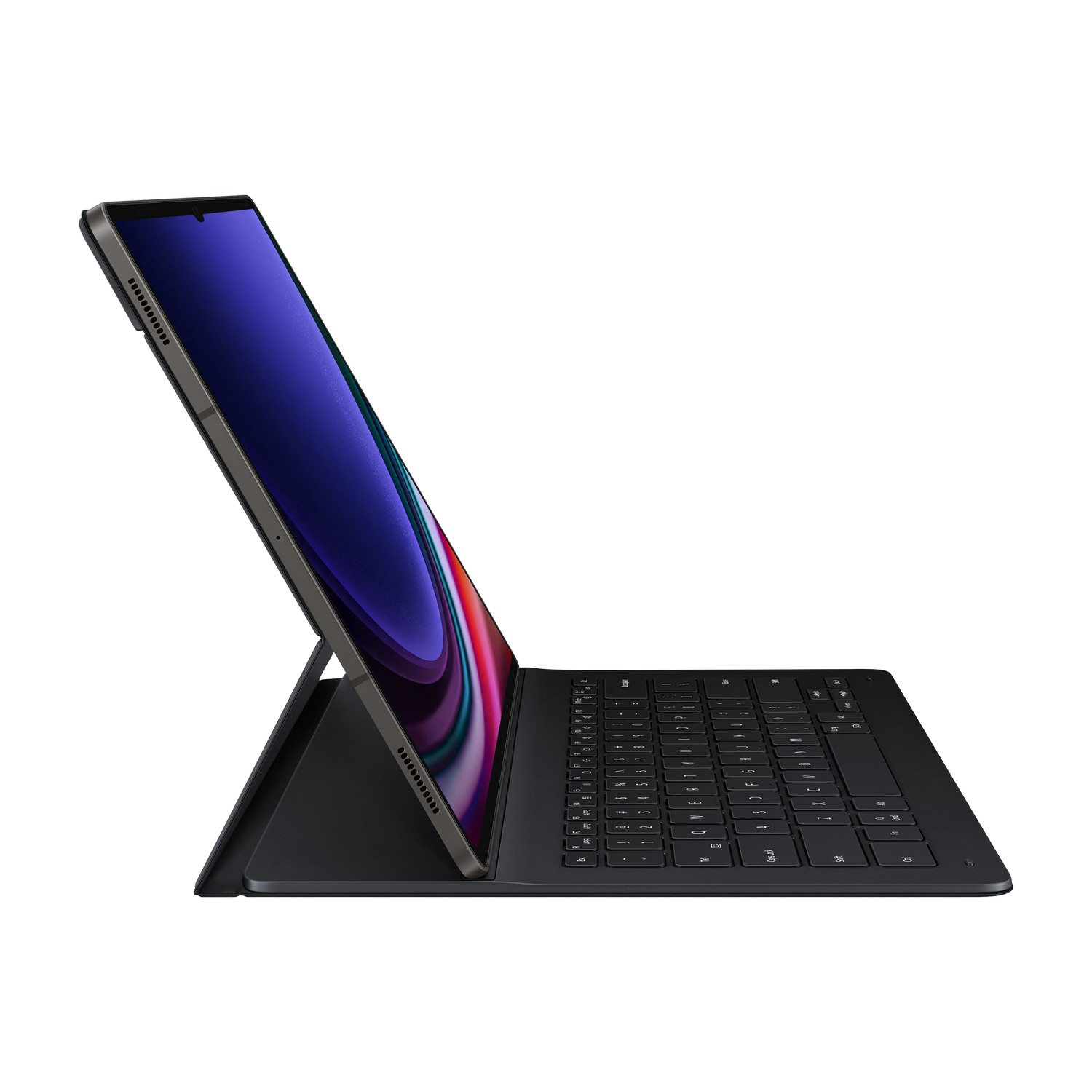 A dark tablet with a keyboard case, viewed from the side. The screen displays a colorful abstract image.
