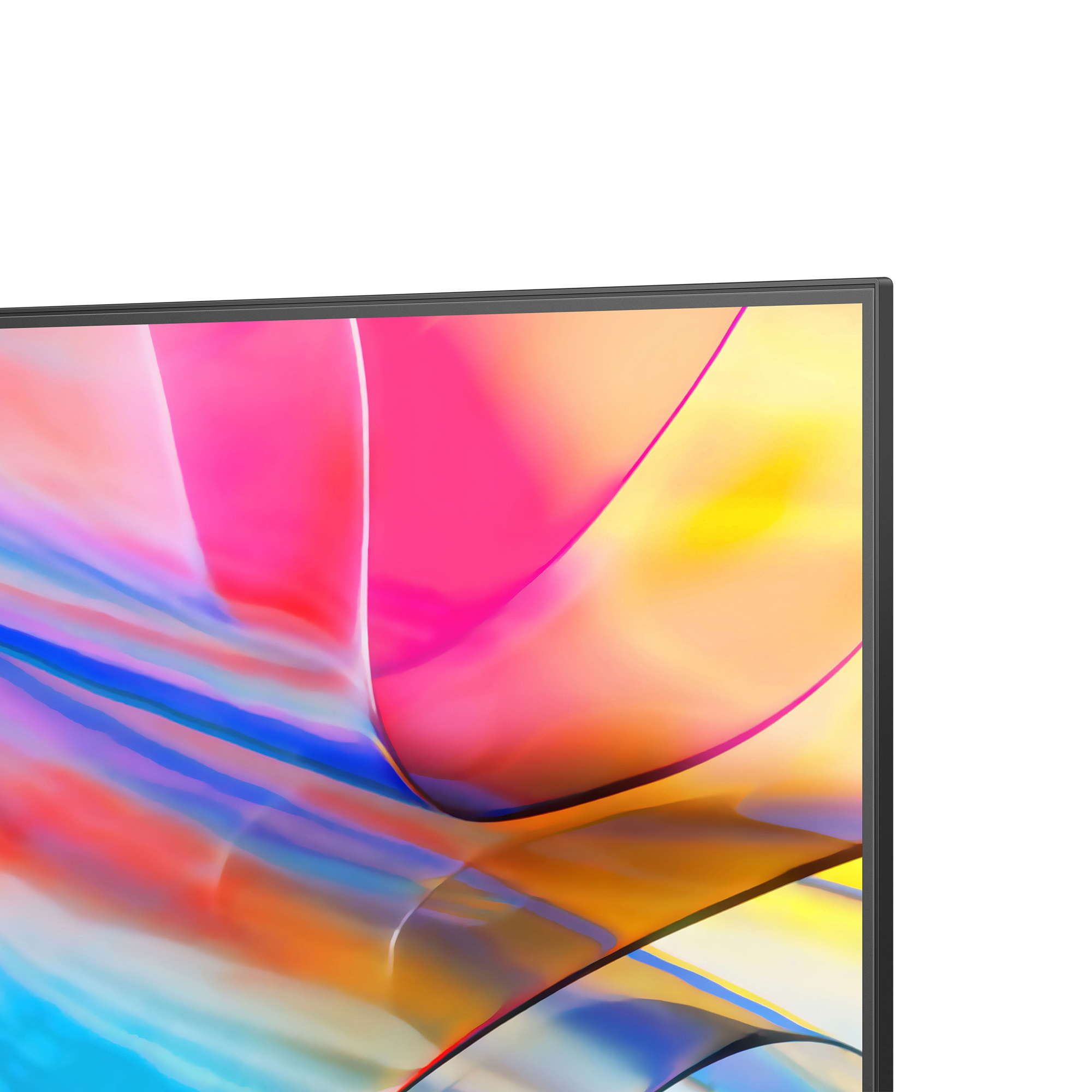 Primer plano de una pantalla de TV que muestra una imagen abstracta colorida. Marco negro visible.