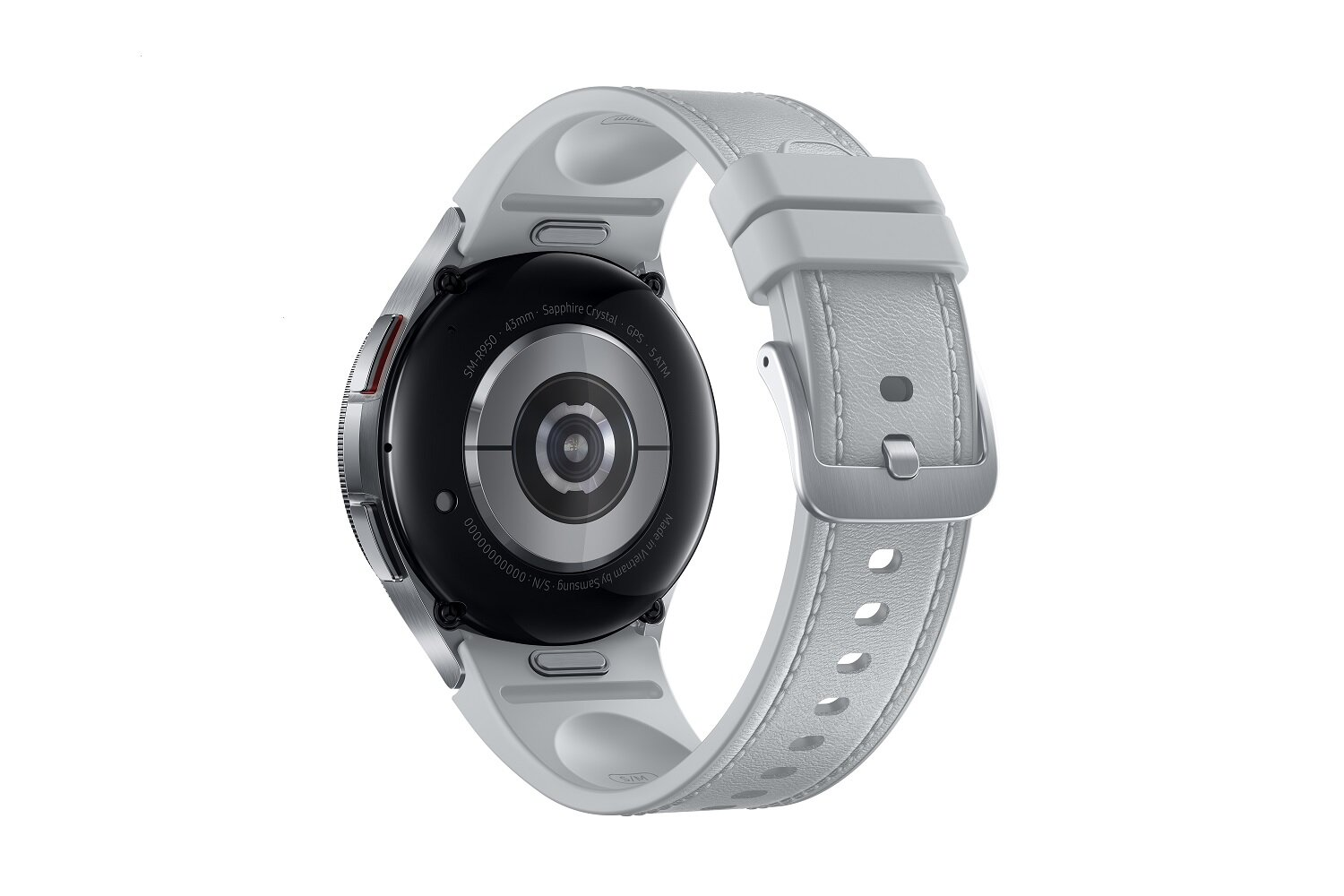Szary smartwatch z białym paskiem, tyłem do góry. Widoczna srebrna klamra. Czarny tył z czujnikami.