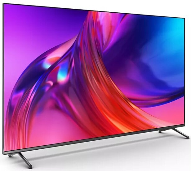 Telewizor z płaskim ekranem, pokazujący abstrakcyjny wzór w kolorach fioletowym, pomarańczowym i czerwonym.