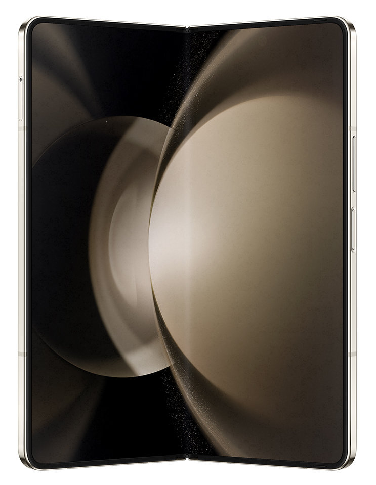 Składany telefon, otwarty. Ekran wyświetla rozmyte beżowe i ciemne kolory.