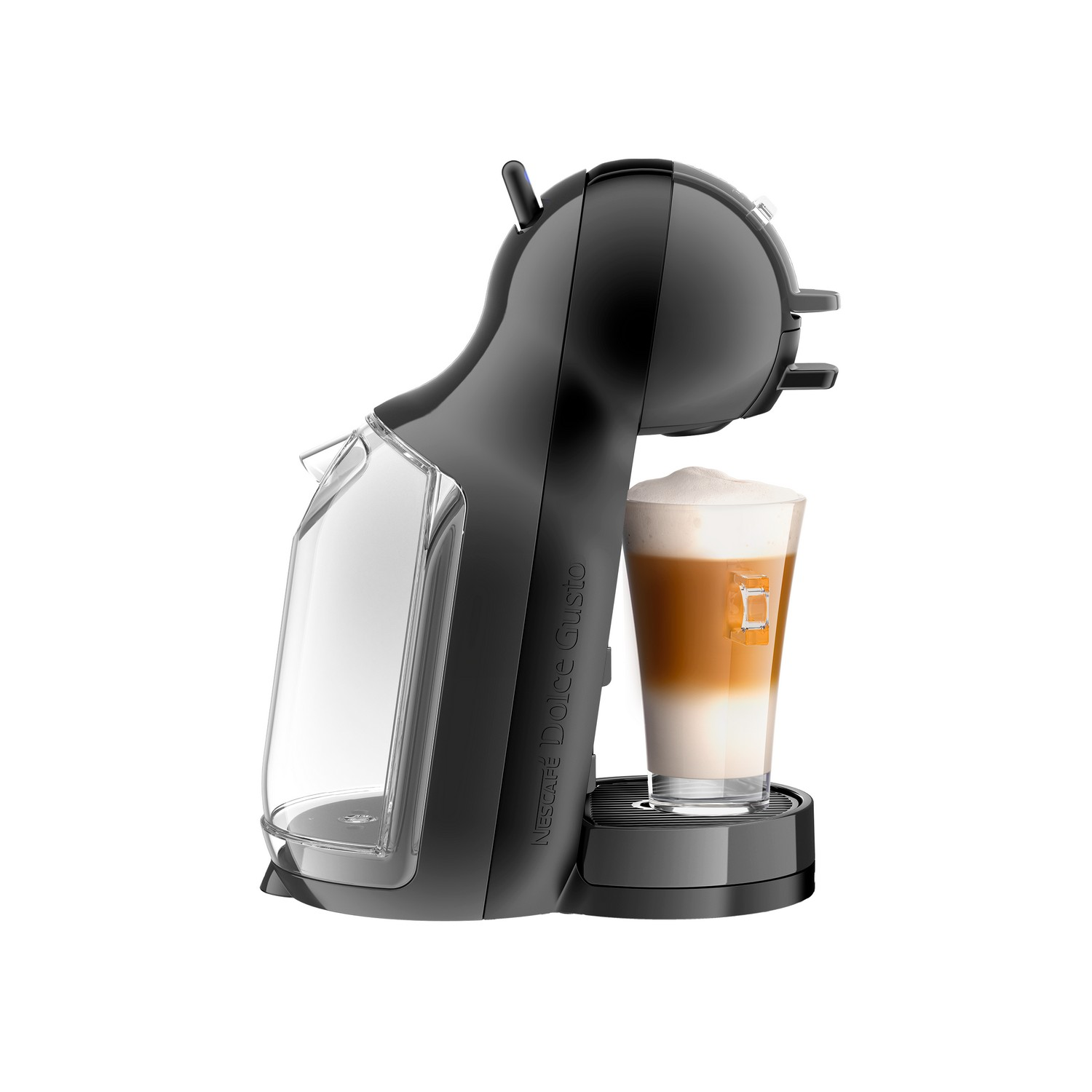 A black Dolce Gusto coffee machine with a glass of layered latte macchiato in front of it, on a white backdrop.