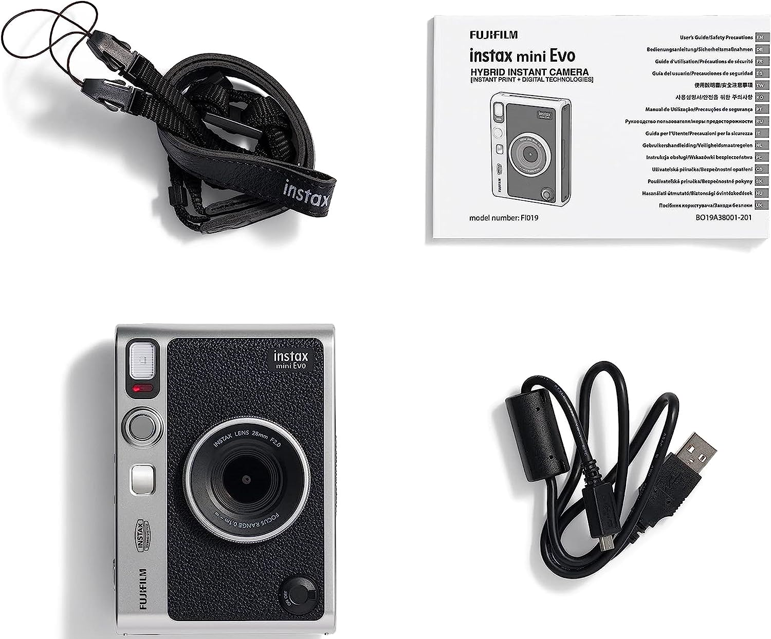 Instax Mini Evo Kamera mit Zubehör: Gurt, Ladegerät, Handbuch. Weißer Hintergrund.