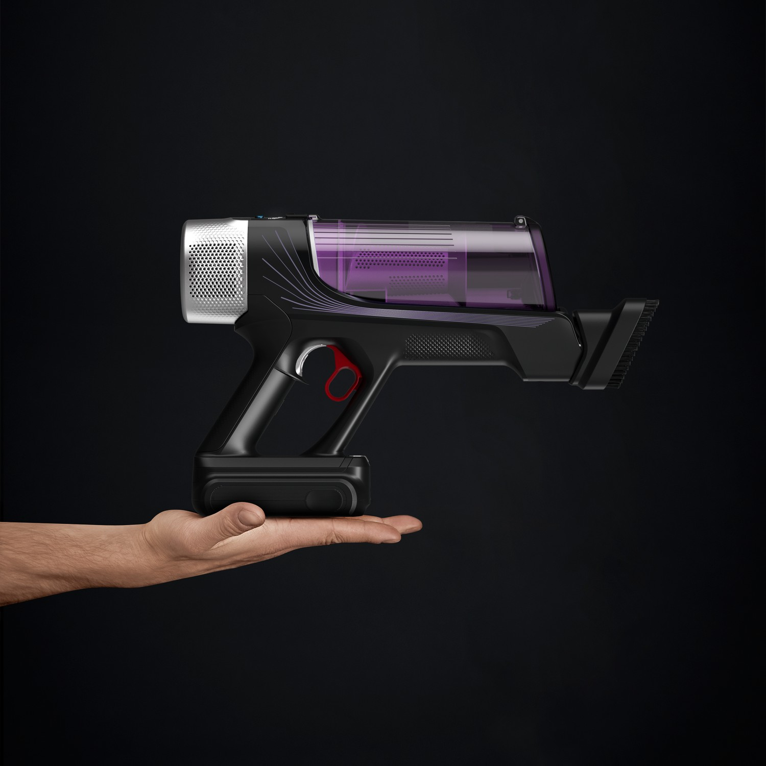 Hand holding a black cordless vacuum cleaner, with a black background.