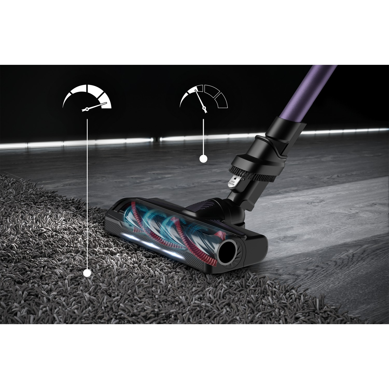 Vacuum cleaner head on a rug. Two gauges show power levels. The background is dark.
