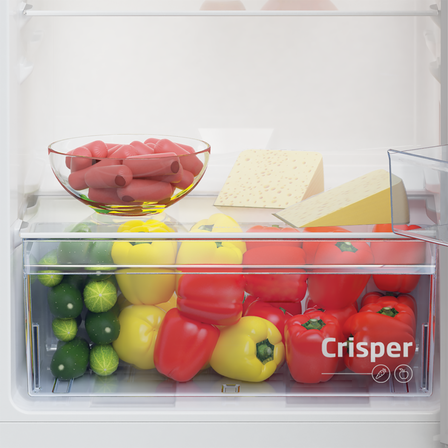 Refrigerator drawer filled with vegetables, cheese, and sausage.