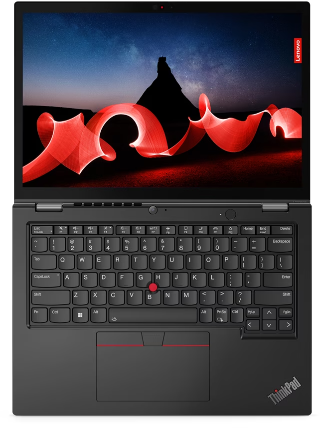 Laptop, geöffnet, Draufsicht. Schwarze Tastatur, roter Trackpoint und ein Bildschirm, der einen Nachthimmel zeigt.