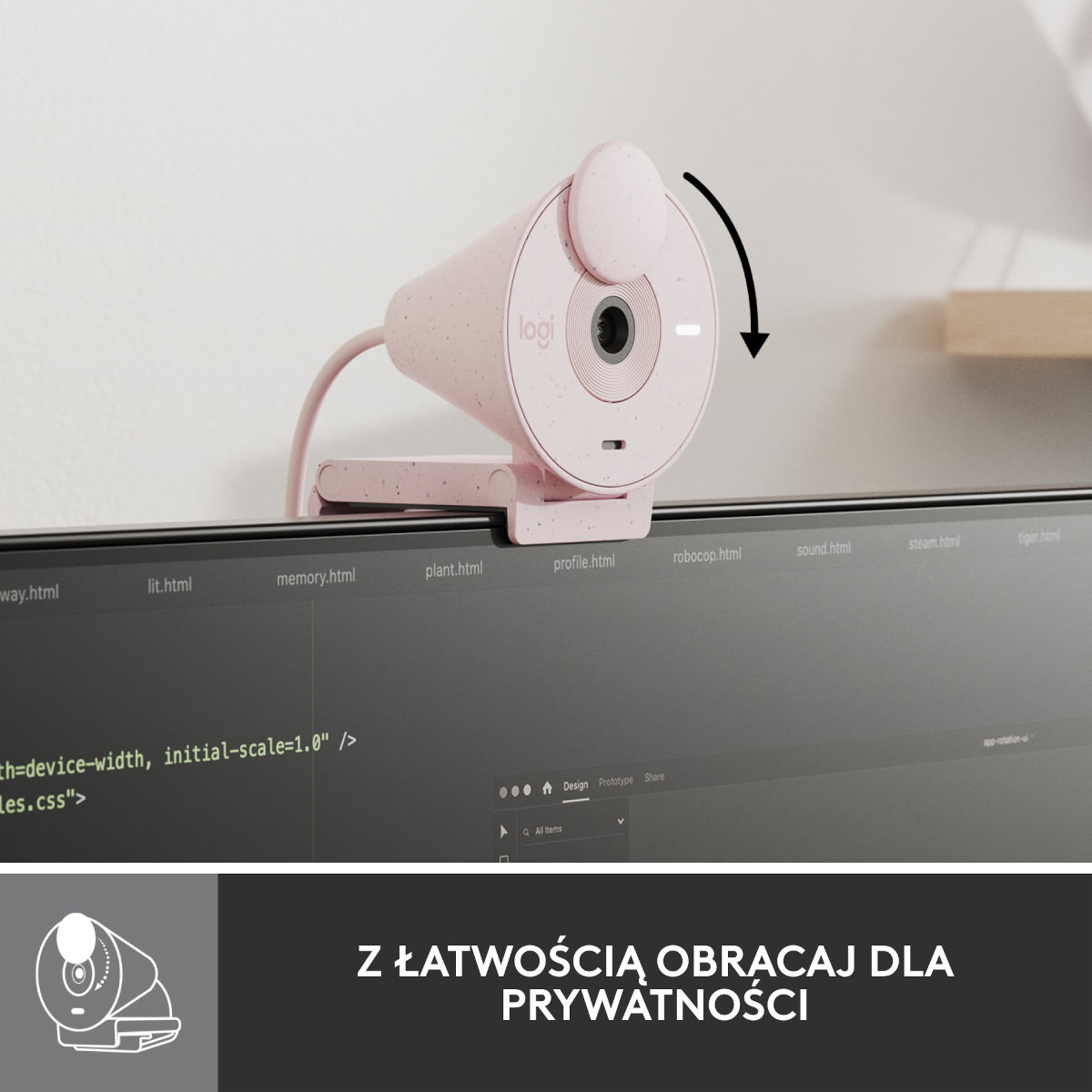 Różowa kamera internetowa Logitech siedzi na monitorze. Osłona obiektywu obraca się. Monitor wyświetla kod i nazwy plików.