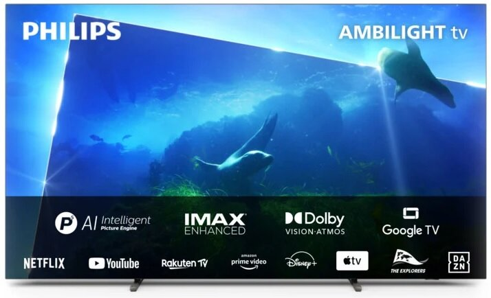 Telewizor Philips Ambilight pokazujący głęboko niebieską podwodną scenę z pływającymi fokami.