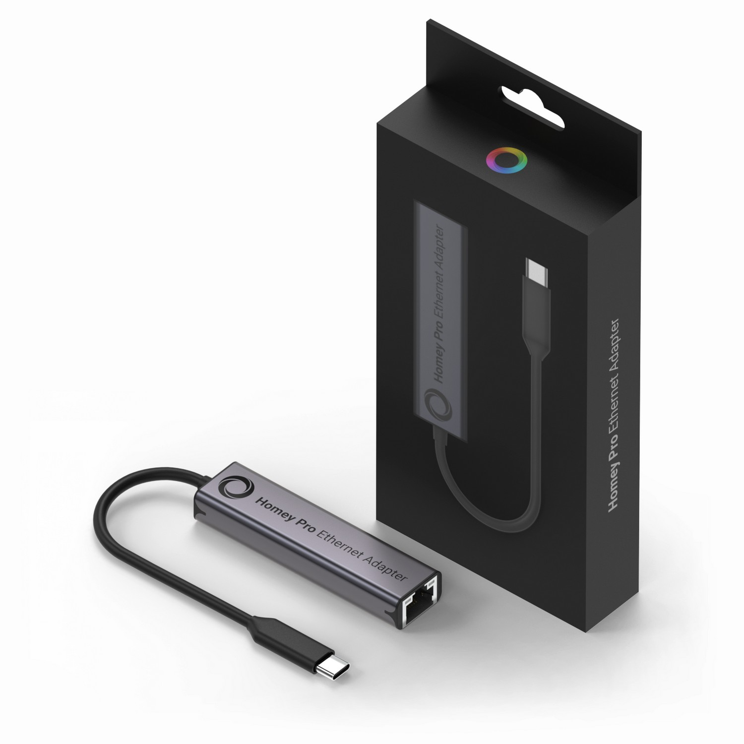 Black box with a grey adapter and a USB-C cable. The box has a logo and the text 'Homey Pro'.