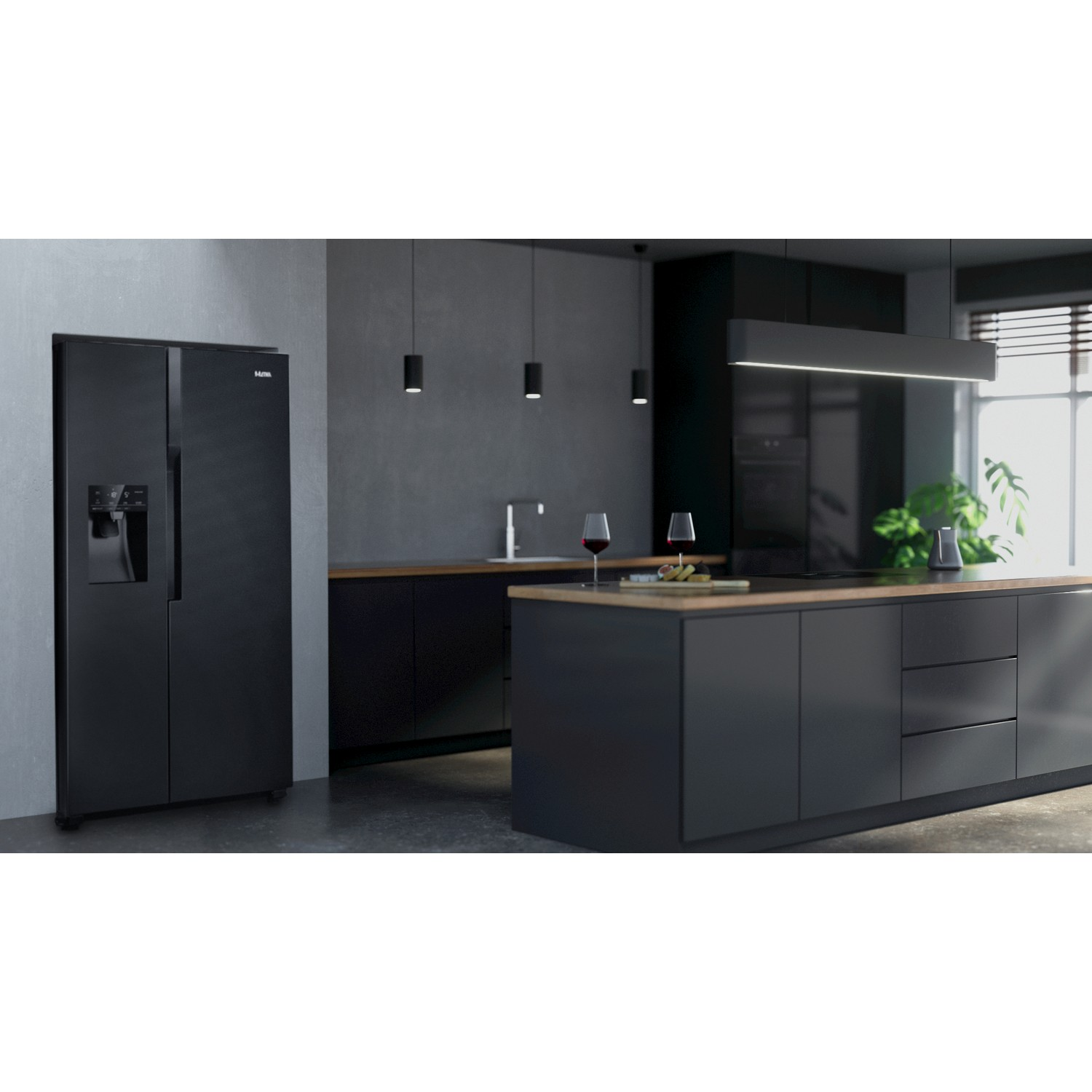 A black refrigerator on the left, and a kitchen island with glasses on the right.