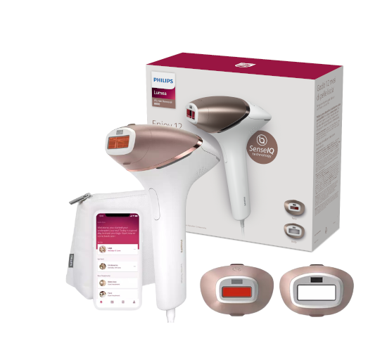 Philips Lumea IPL Gerät und Zubehör. Weißes und roségoldenes Farbschema. Box und Telefon.