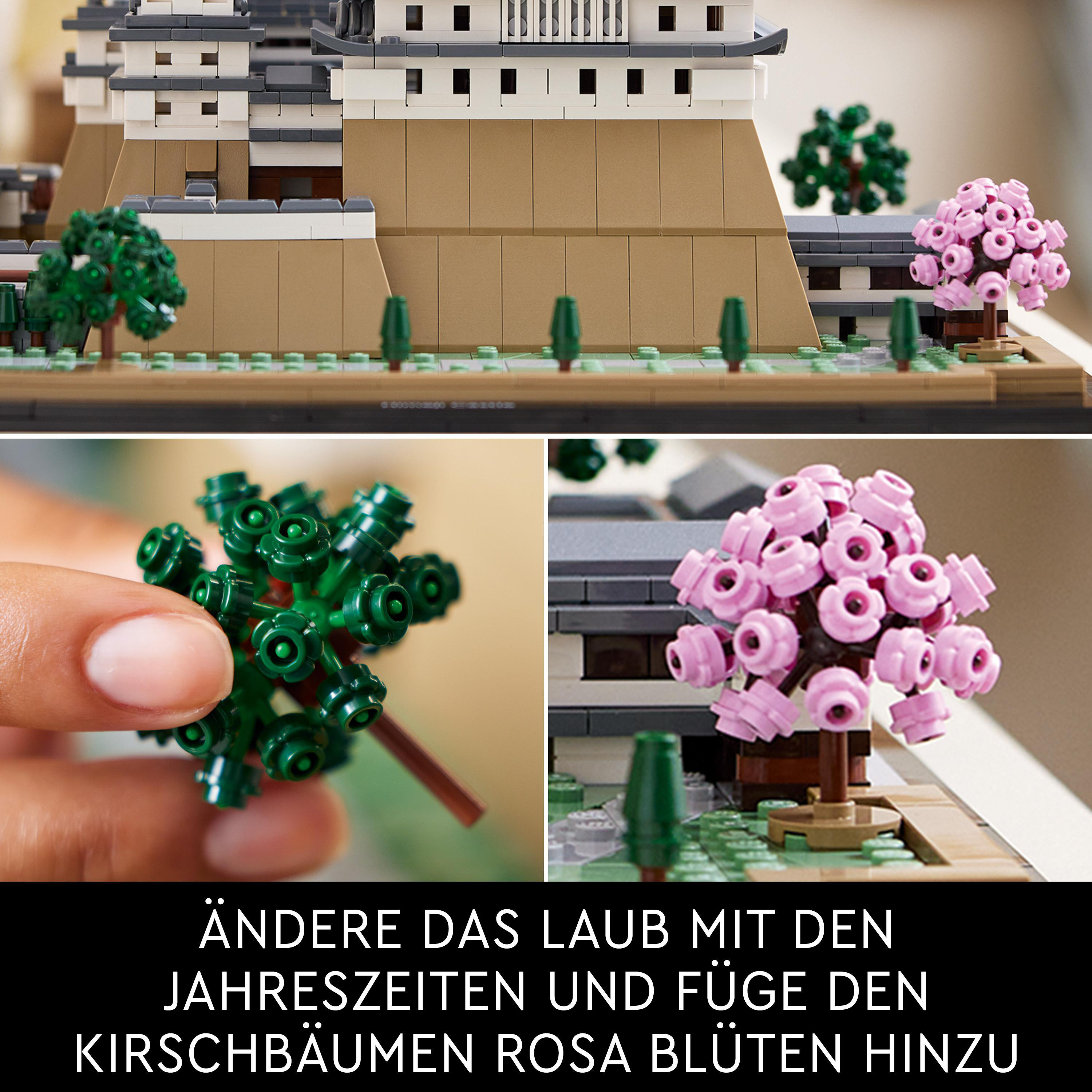 LEGO-Modell eines Schlosses mit Kirschblütenbäumen und grünen Bäumen, mit Nahaufnahmen der Blätter.