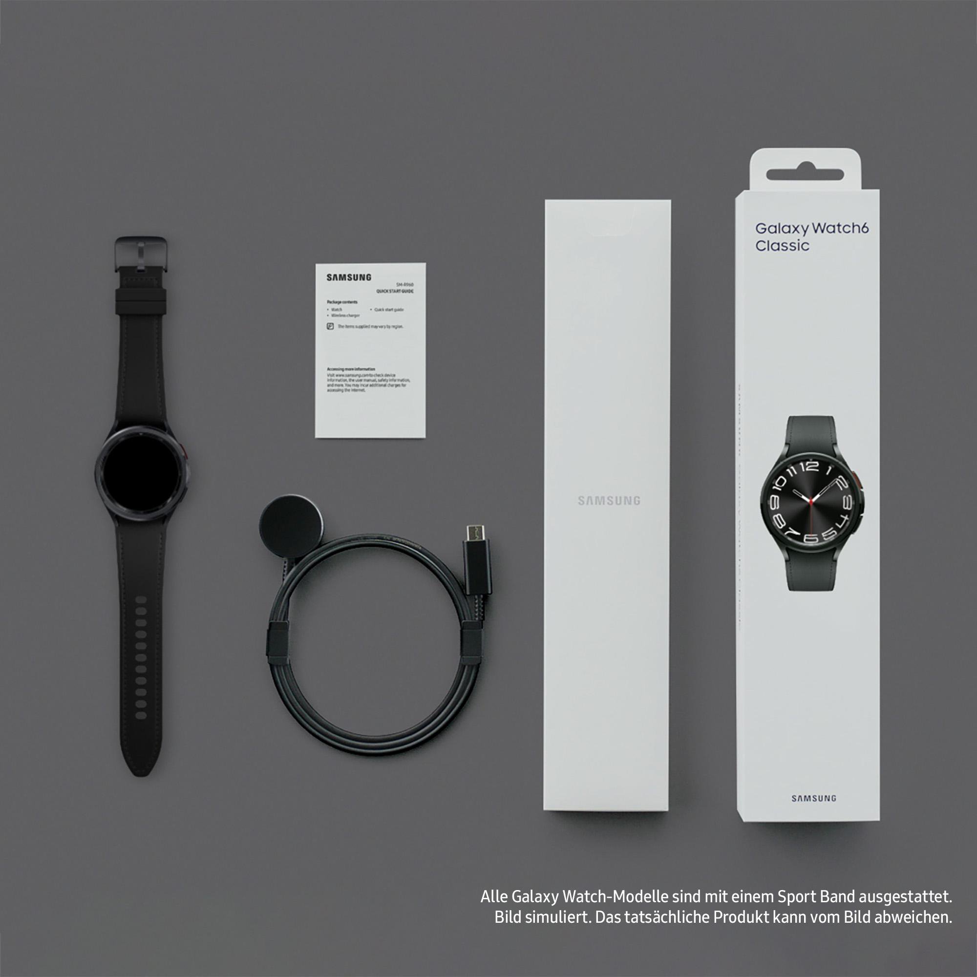 Verpackung und Zubehör der Galaxy Watch6 Classic. Uhr, Ladegerät, Kabel und Dokumentation auf grauem Hintergrund.