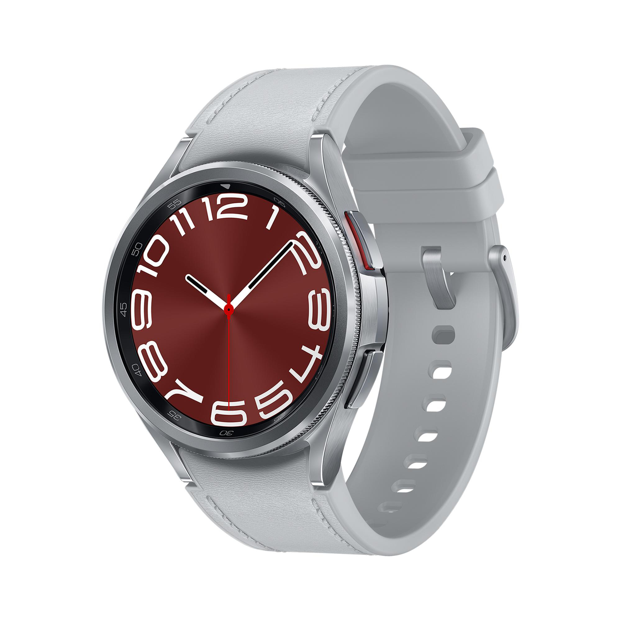 Smartwatch mit rotem Zifferblatt und hellgrauem Armband. Das Zifferblatt zeigt Zahlen und Zeiger.